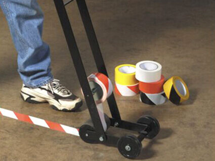 Floor marking with applicator - red white hazard warning tape